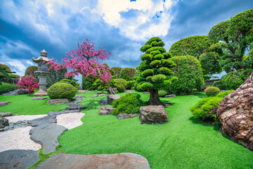 Ecological Garden in designed feng shui with cypress, pine, water and ancient trees bearing...