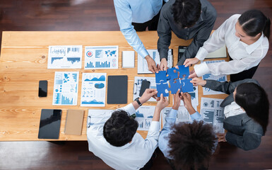 Panorama top view diverse corporate officer worker collaborate in office connect puzzle piece as...