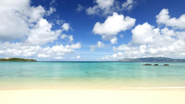 Dramatic view of tropical blue sea or ocean by the white beach and floating clouds in summer, Okinawa in Japan, Nobody, Landscape or travel