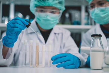 Food scientist testing milk samples of dairy products in the laboratory. Researchers are looking at the stratification of milk.