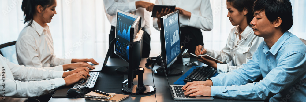 Poster analyst working on data analysis or bi dashboard on computer monitor. business team analyzing financ