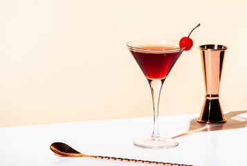 Black Manhattan alcoholic cocktail with whiskey and red vermouth garnished with maraschino cherry...