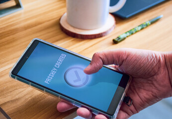 Woman finishing the steps to create passkey in her phone. Passwordless login verification...