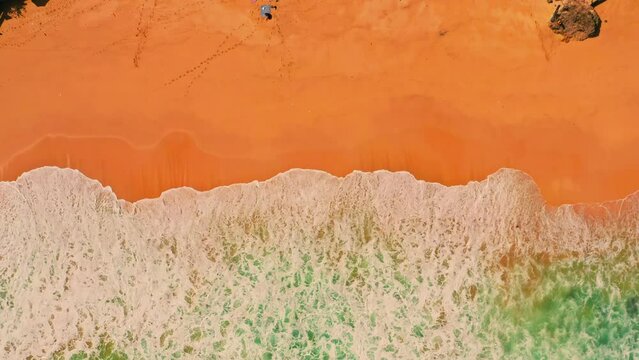 Aerial view of drone. Scene of top view beach and seawater on sandy beach in summer. Nature and travel concept.