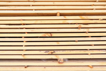 Stock of wooden boards manufacturing Factory in industry. Stacks with pine lumber, wood harvesting shop, Stacked wooden boards for construction.