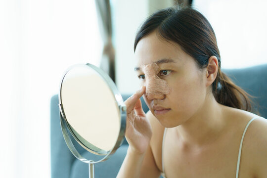 Close Up Of Happy Asian Beautiful Woman Portrait During Her Face And Nose Covered By Soft Splint After Have A Beauty Plastic Surgery