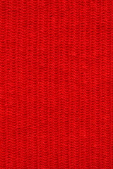 texture of red wool knitted yarn, woolen fabric background