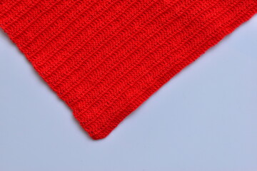 red wool knitted yarn texture, woolen fabric on white background