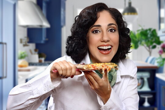 young brunette happy with her sliced pizza
