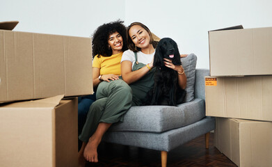 Real estate, portrait and lesbian couple with a dog on the sofa for moving boxes and a new home....