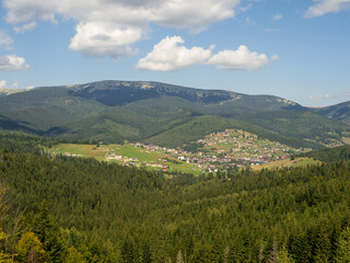 Obraz premium Summer view of mountain ski resort with houses and hotels in Bukovel, Ukraine