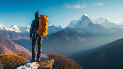 Trekker admiring Nepalese Himalayas, snow-capped peaks, expansive view, crisp morning hues.