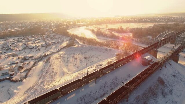 Aerial view of cargo train at winter time. Delivery concept.