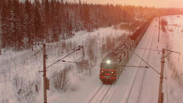 Aerial view of cargo train at winter time. Delivery concept.