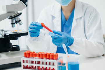 Modern medical research laboratory. female scientist working with micro pipettes analyzing...
