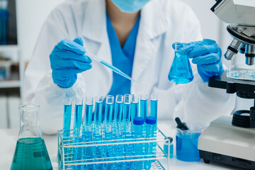 Modern medical research laboratory. female scientist working with micro pipettes analyzing...