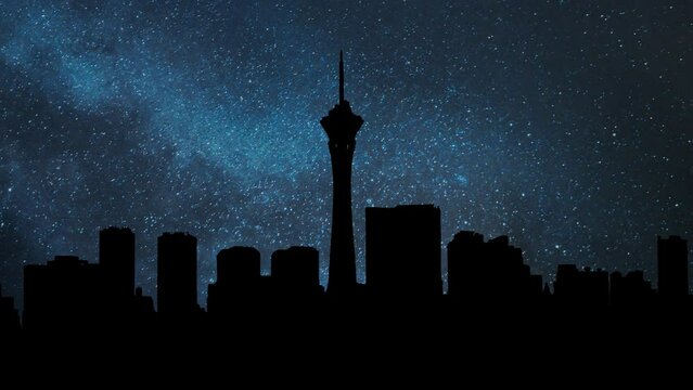 Vegas Skyline by Night, Time Lapse of  the city famous forn nightlife with Stars and Milky Way in Background, Las Vegas, Nevada, USA