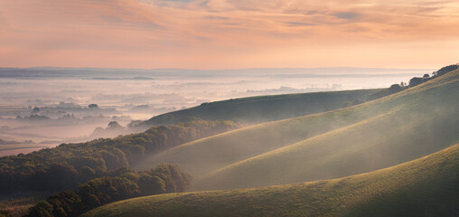 Misty morning on the escarpment of Firle beacon on the south downs in East Sussex south east...
