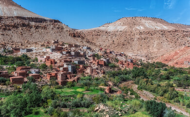Fototapeta na wymiar Small village with at the feet of Atlas mountains, Morocco