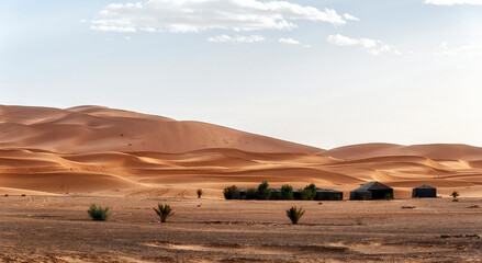 Camp site with tents over sand dunes in Sahara desert, Morocco