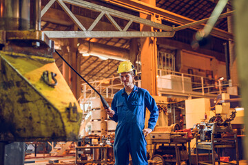 Smiling man working on factory
