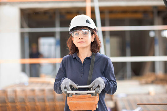 technician female controls with device construction crane
