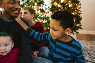 Black father with children happy and smiling at Christmas