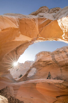 A sunstar inside Melody Arch in Vermilion Cliffs National Monument
