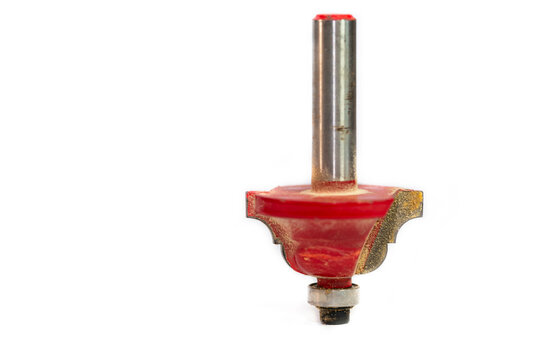 Used, red roman ogee router bit with a bearing on white background, space for text.