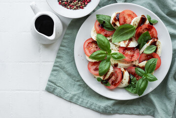 Caprese salad with tomatoes, mozzarella and basil.