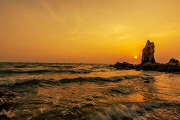 The background of the sea by the evening sea, with natural beauty (sea water, rocks, sky) and...