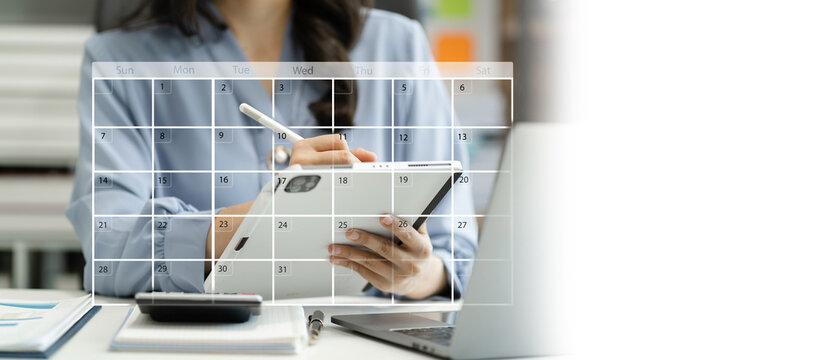 Business woman using digital tablet with calendar planner and organizer to plan and reminder, schedule, timetable, and management, event planning.