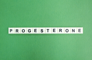 stethoscope and alphabet letters with the word PROGESTERONE. concept of medicine and disease