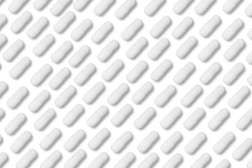 white matte pills or tablets stand in rows on an isolated background