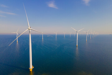 A photo of an offshore wind farm with turbines in the ocean.