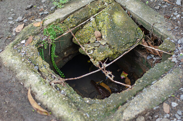 Damaged cement manhole covers, broken steel wires showing on sidewalks and roads are a danger to users.