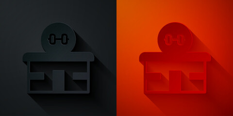 Paper cut Gym building icon isolated on black and red background. Sport club. Paper art style. Vector
