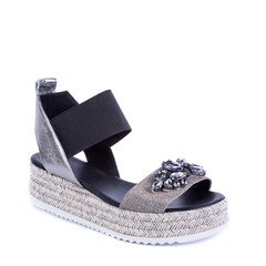 Stylish black-silver sandal decorated with a scattering of rhinestones on white background. Fashion...
