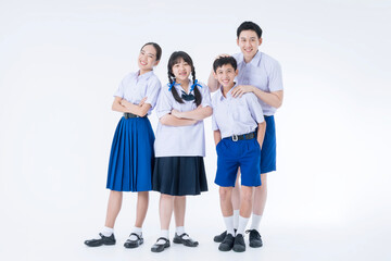 Thai students. Group students standing together in the studio. Asian girl and boy in student uniform on white background.