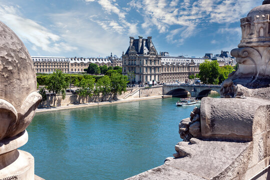 PARIS, France-JUNE 06, 2014: View on river Seine and Louvre Museum on opposite side, from Orsay Museum.