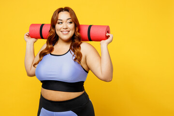 Young smiling chubby overweight plus size big fat fit woman wear blue top warm up training hold...