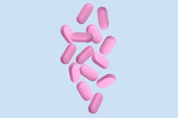 Pink capsules, pills and tablets. On.blue background.