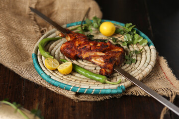 grilled chicken or beaf rib with vegetables selective focus restaurant style.