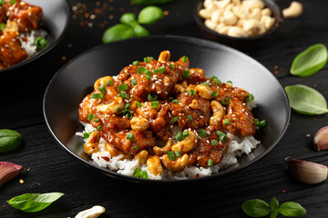Crispy cashew Chicken stir fry with rice. Asian take away food