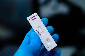 The patient tested positive for influenza A and B using the strip method