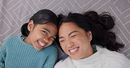 Happy, family kiss and smile on carpet lying in living room with love, mother and young girl. Home, floor and laughing mom with kid together with support, bonding and fun from funny joke on rug