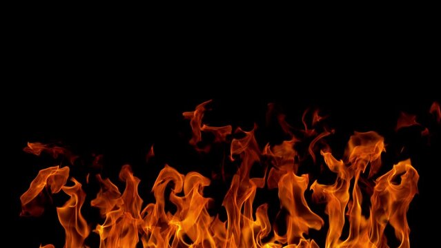 Super slow motion of fire flames isolated on black background. Filmed on high speed cinema camera at 1000 fps