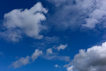Stratocumulus Clouds on Blue Sky Background.