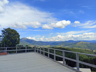 An observation deck that opens an unsurpassed natural picture of the fusion of blue mountain ranges and the snow-white cloudy sky on the horizon.