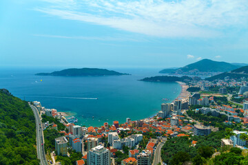 aerial view of the city on the seashore and mountains, panorama of the resorts of Becici and Budva in Montenegro, Adriatic sea, beaches, islands, tourism and travel, summer traveling - obrazy, fototapety, plakaty